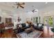 Open concept living room connects to dining area and boasts hardwood floors and ample seating at 9144 Spring Valley Rd, Englewood, FL 34224