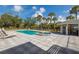 Beautiful backyard pool with a hot tub and outdoor kitchen at 9144 Spring Valley Rd, Englewood, FL 34224