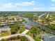 Stunning aerial view of a waterfront home with canal access at 9470 Wacker Ter, Port Charlotte, FL 33981