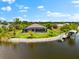 A waterfront property featuring a private dock, a luxurious pool, and canal access at 9470 Wacker Ter, Port Charlotte, FL 33981
