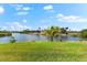 A spacious backyard with a lush lawn on the water at 9470 Wacker Ter, Port Charlotte, FL 33981