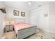 Cozy bedroom offers a comfortable bed, classic decor, and ample storage with a spacious closet for organized living at 9470 Wacker Ter, Port Charlotte, FL 33981