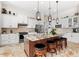 Bright kitchen with stainless steel appliances, a central island, and bar stool seating at 9470 Wacker Ter, Port Charlotte, FL 33981