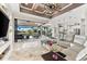 Open floor plan with living room, dining, and kitchen, featuring a view of the pool and canal at 9470 Wacker Ter, Port Charlotte, FL 33981