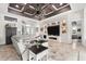 Open-concept living room with modern decor, recessed lighting, and travertine flooring at 9470 Wacker Ter, Port Charlotte, FL 33981