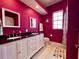 Bathroom featuring dual sinks, modern fixtures, and bright vanity at 9594 Doubloon Trl, Placida, FL 33946