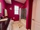 Bathroom featuring modern fixtures, bright wall color, and shower/tub combo at 9594 Doubloon Trl, Placida, FL 33946