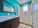 Bright bathroom featuring a glass-enclosed shower with decorative tile, providing a modern and clean space at 9594 Doubloon Trl, Placida, FL 33946