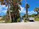 Beach access featuring a sandy path to the beach, vegetation and a golf cart at 9594 Doubloon Trl, Placida, FL 33946