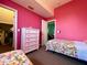 Pink bedroom showing closet and entry to an adjoining room at 9594 Doubloon Trl, Placida, FL 33946