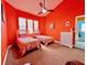 Cozy bedroom with two twin beds, bright wall color, and a ceiling fan at 9594 Doubloon Trl, Placida, FL 33946
