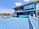 Stunning exterior view of a beautiful home with a large deck, perfect for outdoor living and entertaining at 9594 Doubloon Trl, Placida, FL 33946