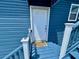 Welcome to this charming coastal home featuring a bright white door with a delightful turtle-themed welcome mat at 9594 Doubloon Trl, Placida, FL 33946