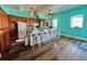 Spacious kitchen with wooden cabinets, white barstools, and tiled backsplash at 9594 Doubloon Trl, Placida, FL 33946