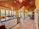 Open concept kitchen and living room with vaulted ceilings and tons of windows at 9594 Doubloon Trl, Placida, FL 33946