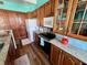 Kitchen with wooden cabinets, granite countertops, and stainless-steel appliances at 9594 Doubloon Trl, Placida, FL 33946