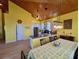 Open concept kitchen and dining area with stainless appliances and wood ceiling at 9594 Doubloon Trl, Placida, FL 33946