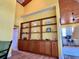 Open-concept living space showcases built-in shelving and bar area at 9594 Doubloon Trl, Placida, FL 33946