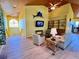 Bright living room features wood ceiling, comfortable seating, and unique marlin wall decor at 9594 Doubloon Trl, Placida, FL 33946