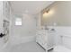 Bathroom featuring classic black and white tile, and a vanity with a marble countertop at 11 Oakland Hills Rd, Rotonda West, FL 33947