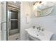 A bright bathroom featuring updated fixtures and a tiled shower at 11 Oakland Hills Rd, Rotonda West, FL 33947