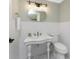 This bathroom features a stand alone sink and updated vanity at 11 Oakland Hills Rd, Rotonda West, FL 33947