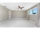 Bright bedroom with a ceiling fan and window at 11 Oakland Hills Rd, Rotonda West, FL 33947