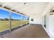 Covered outdoor patio with a view of the golf course and clear panels for optimal viewing at 11 Oakland Hills Rd, Rotonda West, FL 33947