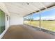 Covered patio featuring a neutral floor and scenic views of the community at 11 Oakland Hills Rd, Rotonda West, FL 33947
