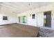 Covered patio with ceiling and sliding glass doors provide seamless indoor-outdoor living at 11 Oakland Hills Rd, Rotonda West, FL 33947