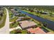 Aerial view of waterfront single-Gathering home showing the community and waterway at 1157 Rotonda Cir, Rotonda West, FL 33947
