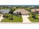Expansive aerial view showcases a beautiful home nestled in a serene neighborhood at 1157 Rotonda Cir, Rotonda West, FL 33947