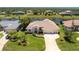 Beautiful home with lush greenery, canal access, and a spacious three-car garage at 1157 Rotonda Cir, Rotonda West, FL 33947