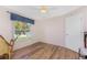 Bedroom featuring wood floors, a ceiling fan, and a window at 1157 Rotonda Cir, Rotonda West, FL 33947