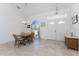 Bright dining area with tile floors, chandelier lighting, and view from window at 1157 Rotonda Cir, Rotonda West, FL 33947