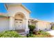 Welcoming front entryway featuring well-maintained landscaping and a covered porch at 1157 Rotonda Cir, Rotonda West, FL 33947