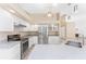 Bright kitchen with stainless steel appliances, quartz countertops, and ample cabinet space at 1157 Rotonda Cir, Rotonda West, FL 33947