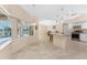 Open living space with view to pool, tile floors and neutral colors at 1157 Rotonda Cir, Rotonda West, FL 33947