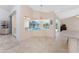 Bright living space with view to pool and tile floors at 1157 Rotonda Cir, Rotonda West, FL 33947