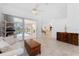 Open living space with tiled floors, sliding glass door and view to the pool at 1157 Rotonda Cir, Rotonda West, FL 33947