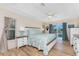 Sunlit main bedroom with wood floors and sliding glass doors leading to the pool area at 1157 Rotonda Cir, Rotonda West, FL 33947