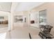 The covered lanai offers views into the living room and kitchen at 1157 Rotonda Cir, Rotonda West, FL 33947