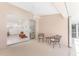 A covered lanai featuring comfortable seating and an open view into the home at 1157 Rotonda Cir, Rotonda West, FL 33947