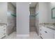 Dual walk-in showers with tiled walls, built-in bench, and a decorative blue mosaic at 13344 Gershwin Ln, Port Charlotte, FL 33981