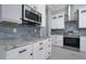 Detail of kitchen with modern appliances, granite counters, stylish backsplash, and ample cabinet space at 13344 Gershwin Ln, Port Charlotte, FL 33981