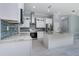 Modern kitchen with granite countertops, stainless steel appliances, sleek white cabinetry, and tile backsplash at 13344 Gershwin Ln, Port Charlotte, FL 33981