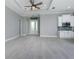 Bright and airy open-concept layout with tile flooring, foyer, and modern kitchen with stainless steel appliances at 13344 Gershwin Ln, Port Charlotte, FL 33981