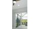 View of the screened in patio with tile flooring and sliding glass doors at 13344 Gershwin Ln, Port Charlotte, FL 33981