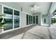 View of the patio with fan, tile floors, and view of the pool at 13344 Gershwin Ln, Port Charlotte, FL 33981