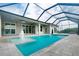The pool features a built in fountain and view of the lanai at 13344 Gershwin Ln, Port Charlotte, FL 33981